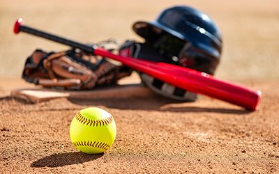 softball equipment on field links to the athletics webpage